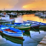 Barche al tramonto a Siracusa